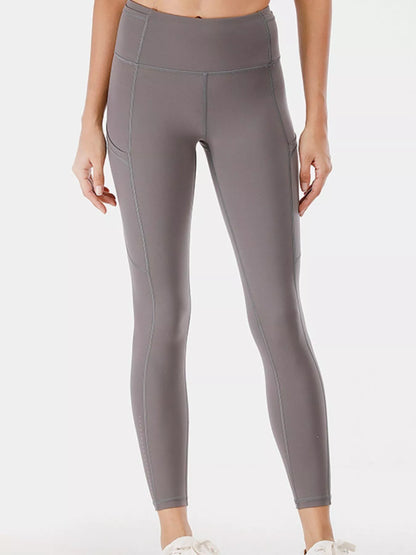Full Size High - Waisted Active Leggings with Pockets Plus Size - L’atelier Sublime